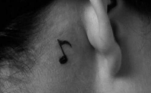 A tattoo behind an ear